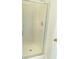 Enclosed glass door shower, offering a sleek and modern bathing experience with a neutral color scheme at 203 Sea Marsh Ct, Fayetteville, GA 30215