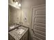 Bathroom featuring granite countertop vanity, decorative lighting and an open door at 333 Darlington Dr, Ellenwood, GA 30294