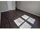 Open bedroom with wood-look flooring, light-colored walls, and white door at 333 Darlington Dr, Ellenwood, GA 30294