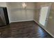 Bright dining area featuring stylish light fixture and glass panel door at 333 Darlington Dr, Ellenwood, GA 30294