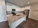 Well-equipped kitchen showcasing stainless steel appliances, granite countertops, and a large island at 333 Darlington Dr, Ellenwood, GA 30294