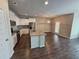 Open-concept kitchen featuring granite countertops, stainless steel appliances, and hardwood flooring at 333 Darlington Dr, Ellenwood, GA 30294