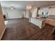 Open-concept living space with fireplace, connecting seamlessly to a modern kitchen with granite countertops at 333 Darlington Dr, Ellenwood, GA 30294