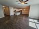 Open-concept living room flows into a kitchen with a center island, stainless appliances and modern lighting at 333 Darlington Dr, Ellenwood, GA 30294