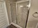 Modern shower with glass doors and marble tiling at 333 Darlington Dr, Ellenwood, GA 30294