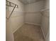 Carpeted walk-in closet with wire shelving and clothing racks at 333 Darlington Dr, Ellenwood, GA 30294