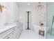 Bright bathroom featuring a soaking tub, a glass enclosed shower, and double vanity with marble countertops at 425 Prestwick Ct, Alpharetta, GA 30005