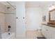 Bathroom with shower-tub, tiled floor, and vanity with sink and granite countertop at 425 Prestwick Ct, Alpharetta, GA 30005