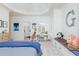 Well-lit bedroom with built-in bench seating, and a writing desk with plush giraffe decor at 425 Prestwick Ct, Alpharetta, GA 30005