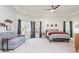 Bright bedroom featuring a comfortable couch, a large window, and neutral carpet at 425 Prestwick Ct, Alpharetta, GA 30005