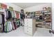 Spacious walk-in closet with custom shelving for clothes, hats, shoes, and other storage needs at 425 Prestwick Ct, Alpharetta, GA 30005