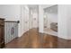 Second floor hallway features dark hardwood flooring with iron railing and a glimpse of the living room at 425 Prestwick Ct, Alpharetta, GA 30005