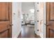 Hallway showcasing a bedroom with bay windows and a bathroom with a soaking tub at 425 Prestwick Ct, Alpharetta, GA 30005