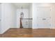 A second floor hallway features a decorative iron railing, wood floors, and a pair of doors at 425 Prestwick Ct, Alpharetta, GA 30005