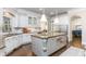 Spacious kitchen features an oversized island with granite countertops, stainless steel appliances, and ample storage at 425 Prestwick Ct, Alpharetta, GA 30005