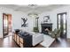 Inviting living room features a fireplace, accent lighting, coffered ceilings, hardwood floors, and stylish decor at 425 Prestwick Ct, Alpharetta, GA 30005
