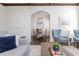 Bright living room features an open concept design to the dining area, hardwood floors, and modern decor at 425 Prestwick Ct, Alpharetta, GA 30005