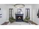 Charming living room with a fireplace, hardwood floors, stylish decor, and ample seating at 425 Prestwick Ct, Alpharetta, GA 30005