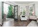 Main bedroom with access to balcony, a bay window, and comfortable seating area at 425 Prestwick Ct, Alpharetta, GA 30005