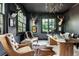 Office features dark walls, hardwood floors, stylish seating, and decorative lighting at 425 Prestwick Ct, Alpharetta, GA 30005