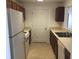 Functional kitchen with white appliances, ample cabinet space, and a view to the adjoining room at 10303 Waldrop Place, Decatur, GA 30034