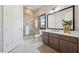 Sleek bathroom featuring a modern shower, double vanity, and contemporary design at 13415 Bishops Ct, Roswell, GA 30075