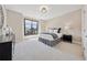 Spacious bedroom featuring neutral tones, a large window, and elegant decor with carpet floors at 13415 Bishops Ct, Roswell, GA 30075