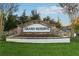 Attractive community sign with stone accents and neatly manicured landscaping at 13415 Bishops Ct, Roswell, GA 30075