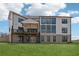 Back exterior elevation showing the deck and expansive windows at 13415 Bishops Ct, Roswell, GA 30075