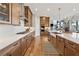 Gourmet kitchen boasts quartz countertops, stainless appliances, and hardwood floors at 13415 Bishops Ct, Roswell, GA 30075