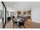 Open concept kitchen and dining area with hardwood floors and stainless steel appliances at 13415 Bishops Ct, Roswell, GA 30075