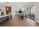 Open kitchen and living area with a central island and modern lighting fixtures at 13415 Bishops Ct, Roswell, GA 30075