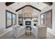 Charming living room with a stone fireplace and inviting seating, ideal for cozy gatherings at 13415 Bishops Ct, Roswell, GA 30075