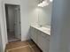 Bathroom features a double sink vanity with white cabinets and modern fixtures at 2113 Boxwood Se Cir, Conyers, GA 30094