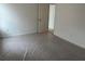 Bright bedroom featuring neutral walls, flooring covered in protective wrap, and a doorway at 2113 Boxwood Se Cir, Conyers, GA 30094