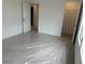 Bedroom with ensuite bathroom and walk-in closet, carpet with protective plastic at 2113 Boxwood Se Cir, Conyers, GA 30094