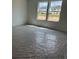 Bright bedroom with two windows, newly installed carpet with protective plastic at 2113 Boxwood Se Cir, Conyers, GA 30094