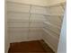 Spacious walk-in closet with ample shelving, providing plenty of storage for clothes and accessories at 2113 Boxwood Se Cir, Conyers, GA 30094