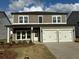 Charming two-story home with a welcoming front porch and a two-car garage, perfect for a growing Gathering at 2113 Boxwood Se Cir, Conyers, GA 30094