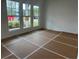 Bright living room with large windows offering natural light and a view of the outdoors at 2113 Boxwood Se Cir, Conyers, GA 30094