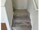 Carpeted staircase with plastic protection for easy moving, freshly painted white walls at 2113 Boxwood Se Cir, Conyers, GA 30094