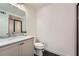 Modern bathroom featuring a sleek vanity, elegant mirror, and a glass-enclosed shower at 8 Bass Se St, Atlanta, GA 30315