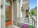 Charming front porch with a vibrant orange door and well-maintained landscaping at 8 Bass Se St, Atlanta, GA 30315