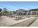 Expansive outdoor seating area with picnic tables under string lights, perfect for gatherings at 8 Bass Se St, Atlanta, GA 30315
