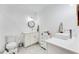 A clean bathroom features a double vanity, a toilet, and tiled floors at 1506 Avon Sw Ave, Atlanta, GA 30311