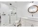 Bright bathroom with glass-enclosed shower, modern vanity, and stylish mirror at 1506 Avon Sw Ave, Atlanta, GA 30311