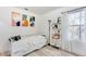 Bright bedroom features decor, natural light from a window, and new wood floors at 1506 Avon Sw Ave, Atlanta, GA 30311