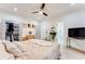 Spacious main bedroom features light wood flooring, a ceiling fan, and ample closet space at 1506 Avon Sw Ave, Atlanta, GA 30311