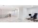 Bright hallway features light hardwood floors and a modern workstation with an office chair at 1506 Avon Sw Ave, Atlanta, GA 30311
