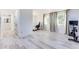 Hallway with an office setup, Peloton bike, and natural light streaming through the windows at 1506 Avon Sw Ave, Atlanta, GA 30311
